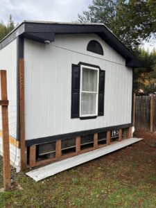 Exterior of a building showing new skirting or foundation repair work by 1775 Handyman Services in Kalispell, MT.