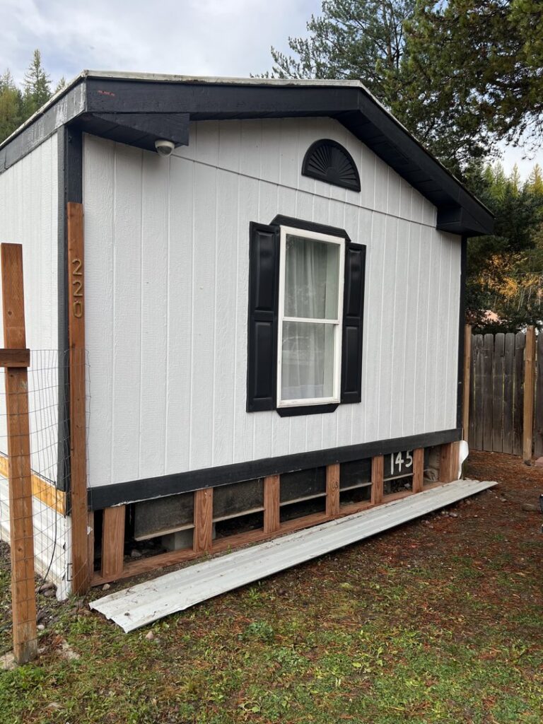Exterior of a building showing new skirting or foundation repair work by 1775 Handyman Services in Kalispell, MT.