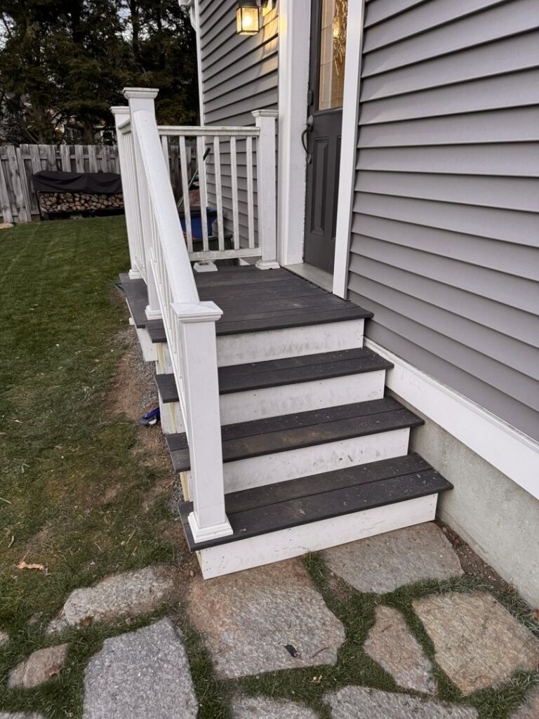Newly installed exterior stairs and railing by Premier Handyman Services in Lexington, KY.