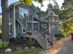Exterior stairs and railing installation on a house by APS Residential Services in Livonia, MI.