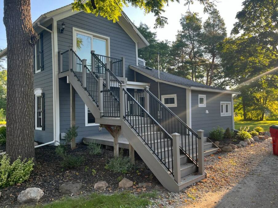 Exterior stairs and railing installation on a house by APS Residential Services in Livonia, MI.