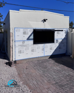 An exterior wall showing insulation and new window installation in progress from Precision Blueprint Design & Development in San Tan Valley, AZ.