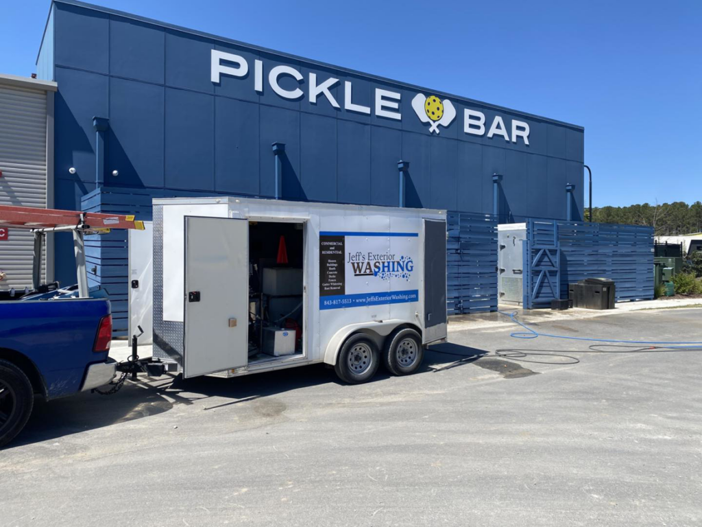 Jeff's Exterior Washing equipment trailer parked at a commercial job site for exterior cleaning in Summerville, SC.