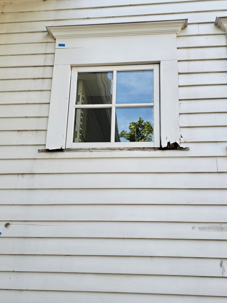 Exterior window frame with visible damage on a house serviced by KTL Home Repair and Remodeling in Norman, OK