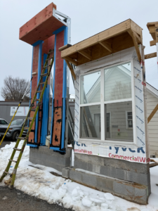 Exterior window installation and building wrap by Hourigan handyman services in Richmond, VA.