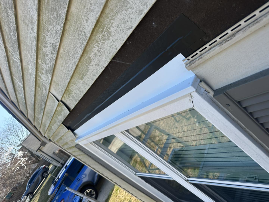Close-up of exterior window trim and flashing repair completed by Jps handyman services,inc in Hampton, VA.