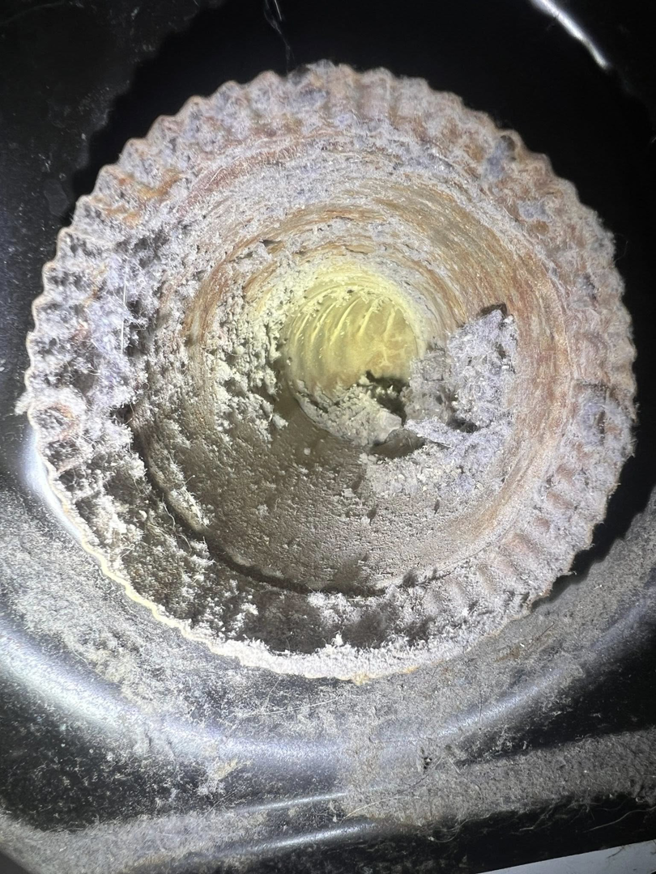 An extremely dirty and lint-clogged vent interior, highlighting the need for Elite Vent Cleaning services in Bluebird Lane.