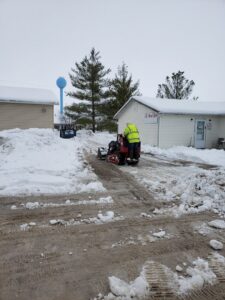 A large tree fallen onto a residential house, indicating the need for emergency tree removal services from King's Tree Service LLC in Winfield, MO.