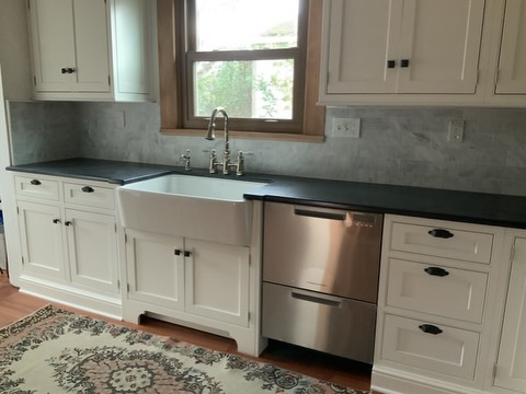 Farmhouse sink and dishwasher installation as part of a kitchen remodel by Balance Painting & Remodeling, LLC in Portland, OR.
