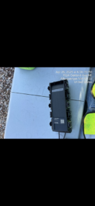 A close-up of a fiber optic component on a work table, part of the general contracting services by KPL Fiber Solutions LLC in Houston, TX.