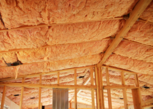 Fiberglass batt insulation installed in a ceiling and wall framing by Ohio Insulation & Manufacturing Co in Dayton, OH.
