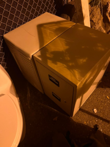 Two filing cabinets and other items placed outdoors for general junk removal by Junk2Dump in Sacramento, CA.