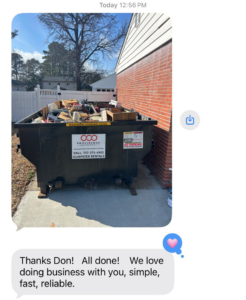 A filled dumpster with various junk items after a successful junk removal job by Providence Dumpster Rentals in Norfolk, VA.