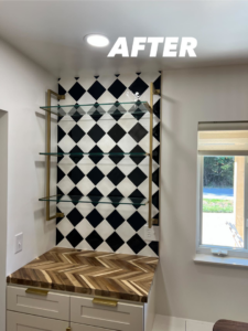 A beautifully finished bar area with black and white diamond tiles and glass shelves by Home Changes in Knoxville, TN