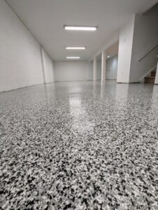 A newly finished basement with a durable epoxy floor by Roche Epoxy Floors in Allentown, PA.