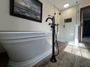 A finished bathroom renovation featuring a freestanding tub and new shower by Fine Line Painting and Design in Georgetown, KY.