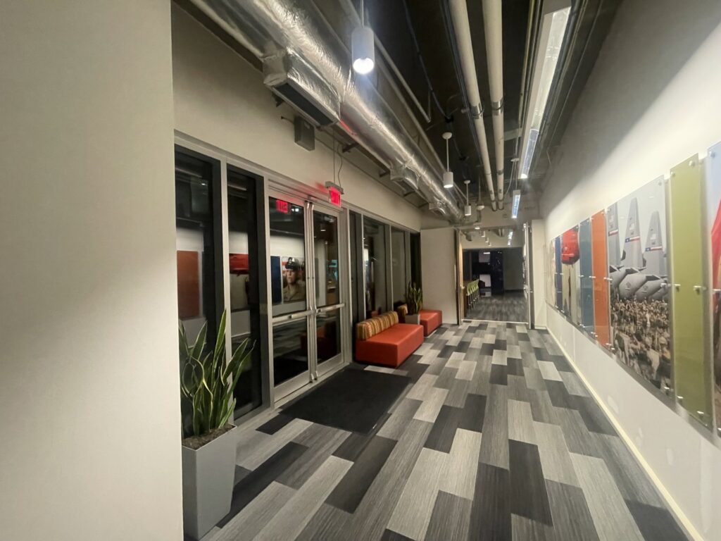 A finished commercial hallway interior with modern design elements by Ricos Renovations in Arlington, TX