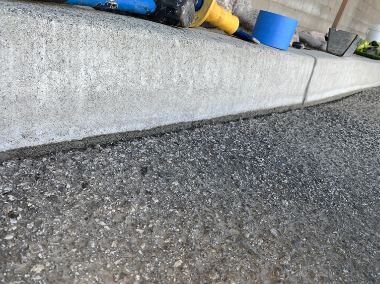Finished concrete curb seal after repair work by Hollywood Handyman in Glendale, CA.