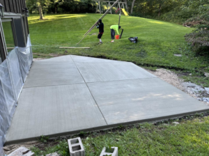 A newly finished concrete patio with control joints installed by R&A Concrete Home Solutions LLC in Appleton, WI.