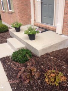 A finished concrete porch and steps after leveling, highlighting the expert service of A1 Concrete Leveling Cincinnati/NKY in Cincinnati, OH.