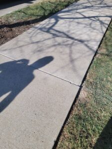 A finished concrete sidewalk, installed with precision by Gonzalez Services Corp. in Nashville, TN.