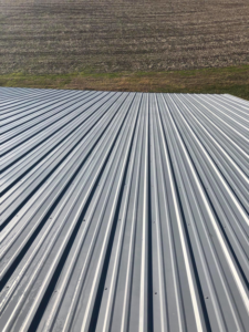 A newly finished and clean corrugated metal roof by Extreme Precision Painting in Elizabethtown, KY.