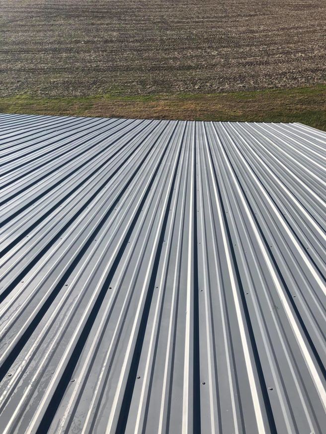 A newly finished and clean corrugated metal roof by Extreme Precision Painting in Elizabethtown, KY.