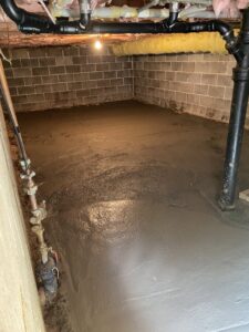 A clean and finished crawl space with a smooth concrete or sealed floor, indicating professional encapsulation work by Northwest Crawl Space Services in Kent, WA.