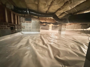 A completed crawlspace encapsulation project with vapor barrier and brick piers by Crawlspace Medic of Knoxville, TN
