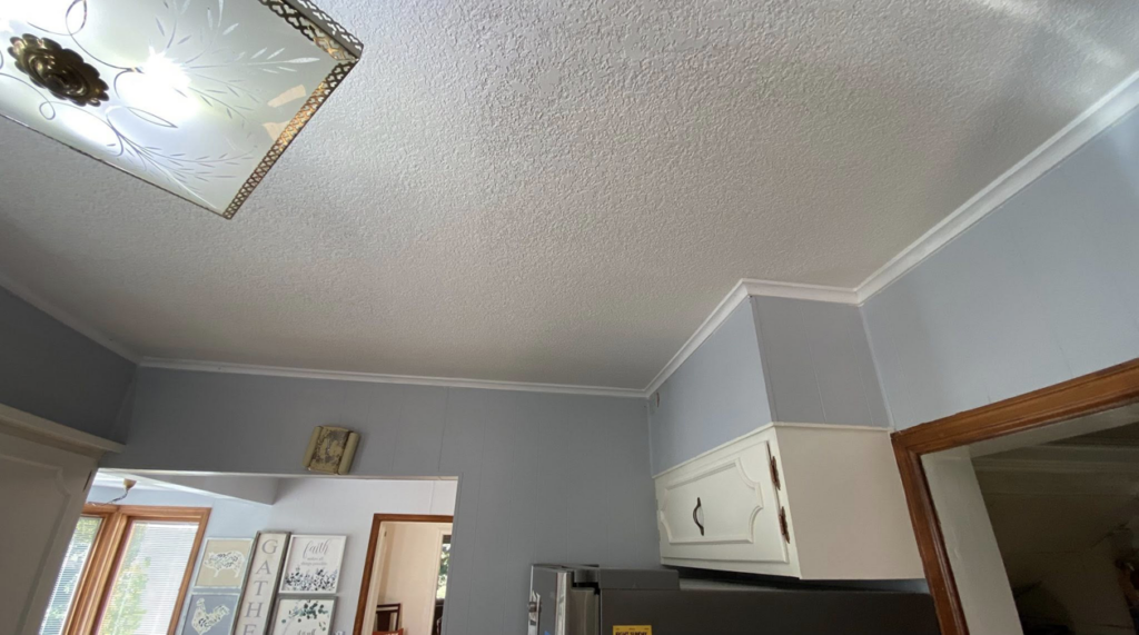 A finished kitchen corner with new white crown molding installed by Blackbird Custom Carpentry in Kansas City, MO.