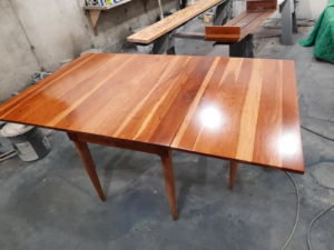 A finished custom wood drop-leaf table by Don's Custom Woodwork in Jefferson City, MO.