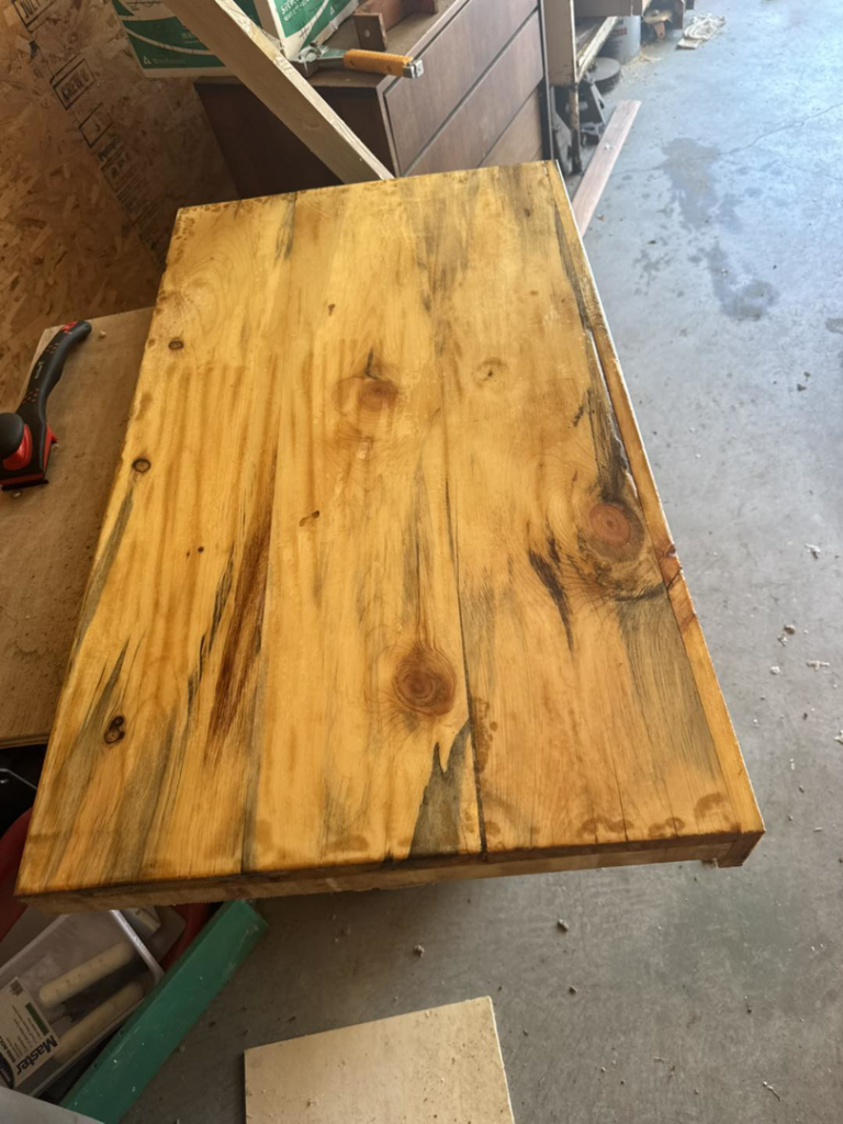 A finished custom wooden countertop or vanity top on a workbench by Shurigar Home Repair & Handyman in Kenesaw, NE.
