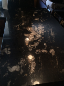 A finished dark granite countertop installation in a home by AZ Custom Granite in Glendale, AZ.