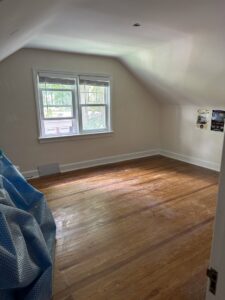 An empty room with smoothly finished drywall and plaster walls and ceiling, ready for painting by N. Bennecoff Drywall & Plaster in Lancaster, PA.