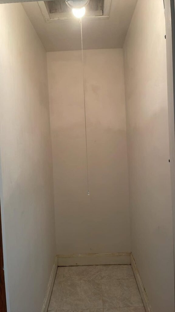 A finished fireplace in a living room, completed by Borrelli Plastering & Sons in O'Fallon, MO.