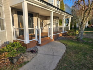 A newly finished front porch with new railings and steps by Universal Builders LLC in New Haven, CT.