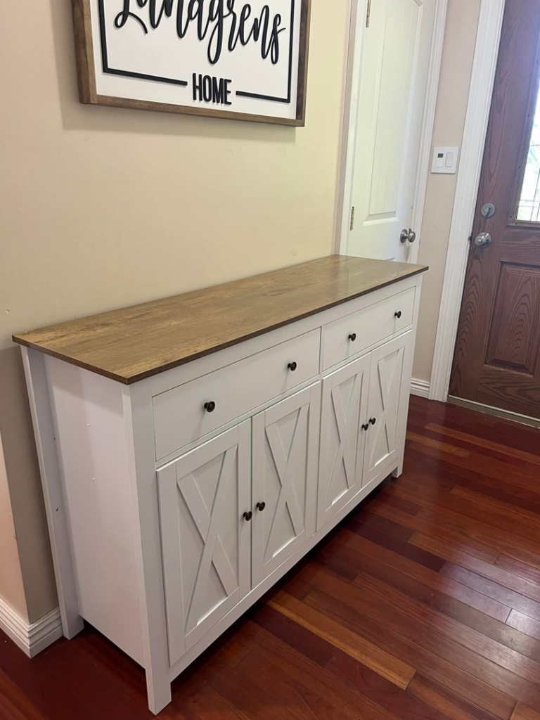 A beautifully finished white cabinet with a wooden top, expertly assembled by Assembly Required in Summerville, SC.