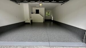 A newly finished garage with a gray epoxy flake floor by Dappa Epoxy Flooring Contractor in Tampa, FL.