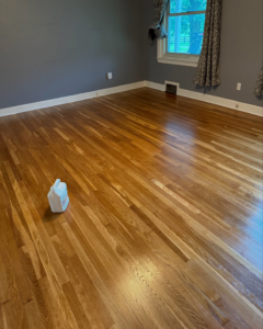 A room showcasing a perfectly finished hardwood floor, recently completed by Cordell Hardwood Flooring in Lexington, KY.