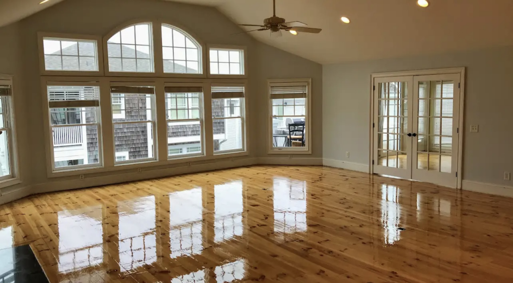 Beautifully finished hardwood flooring in a living room by Wolff Renovation in Wilmington, NC.