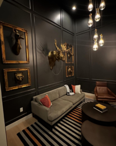 A finished interior room featuring custom wall paneling and lighting by Orange Door Custom Coatings in Phoenix, AZ.