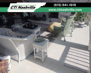 A beautifully finished outdoor concrete patio with comfortable furniture, completed by CTi Nashville in Antioch, TN.