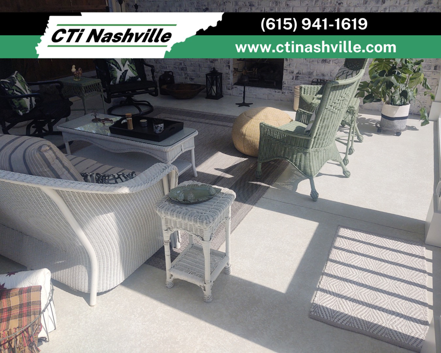 A beautifully finished outdoor concrete patio with comfortable furniture, completed by CTi Nashville in Antioch, TN.