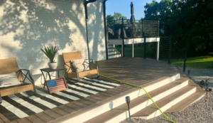 A beautifully finished outdoor deck with modern railing and stairs, completed by DELM Construction & Remodeling LLC in Evansville, IN.