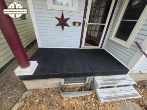 A newly resurfaced porch with black matting completed by Dustin's Handyman Services LLC in Great Falls, MT.