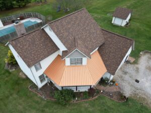 Aerial view of a completed residential roofing project with new shingles and metal roof by Moonshot Roofing in Columbia, PA.