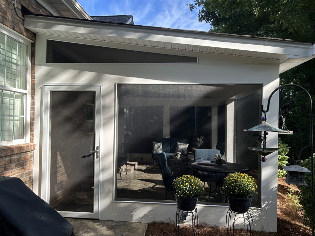 A beautifully finished screened porch with outdoor furniture, completed by Contractor Kev LLC in Winston-Salem, NC