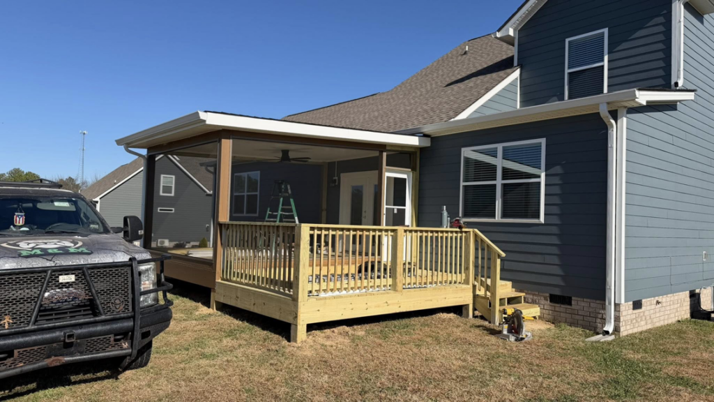 A finished screened porch and open wooden deck with railings, built by M&M Handyman Services LLC in Clarksville, TN.