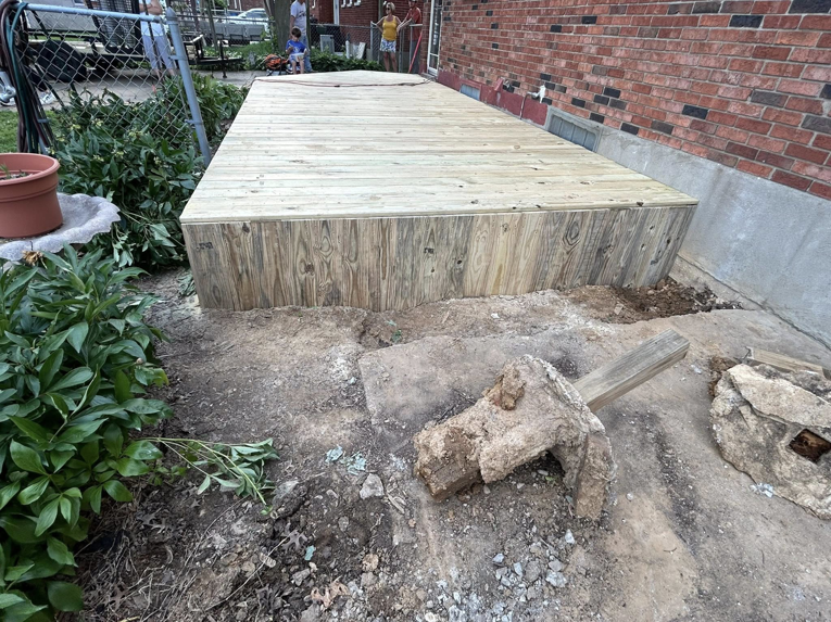 The finished side of a newly constructed wooden deck, showing the sturdy base, completed by A2 Construction in Louisville, KY.