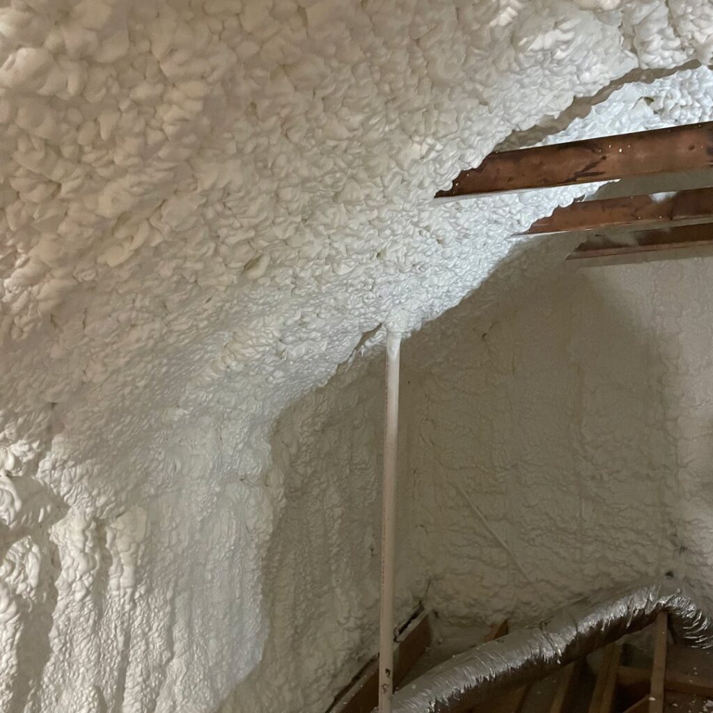 Close-up of newly applied spray foam insulation on an attic ceiling by Koala Insulation of Charlotte, NC